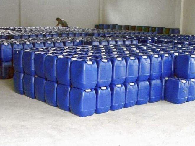 Amber liquid RO antiscalant chemical in plastic drum packaging for water treatment systems